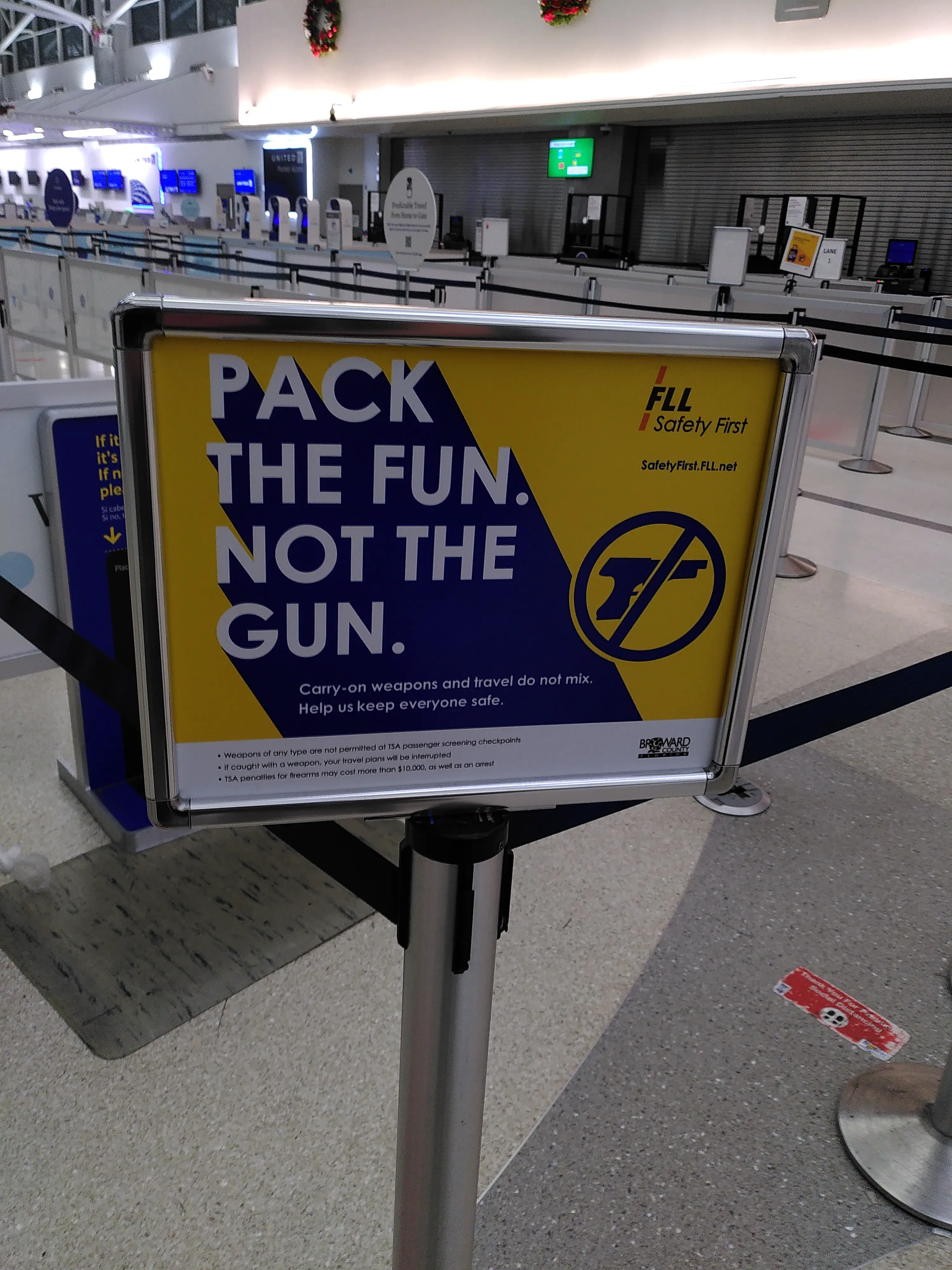 An airport sign telling travellers to ‘pack the fun, not the gun’