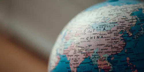 Close up of a desk globe, centered on China