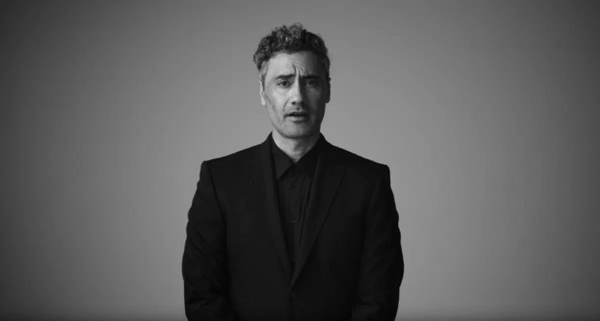 A black and white still of Taika Waititi