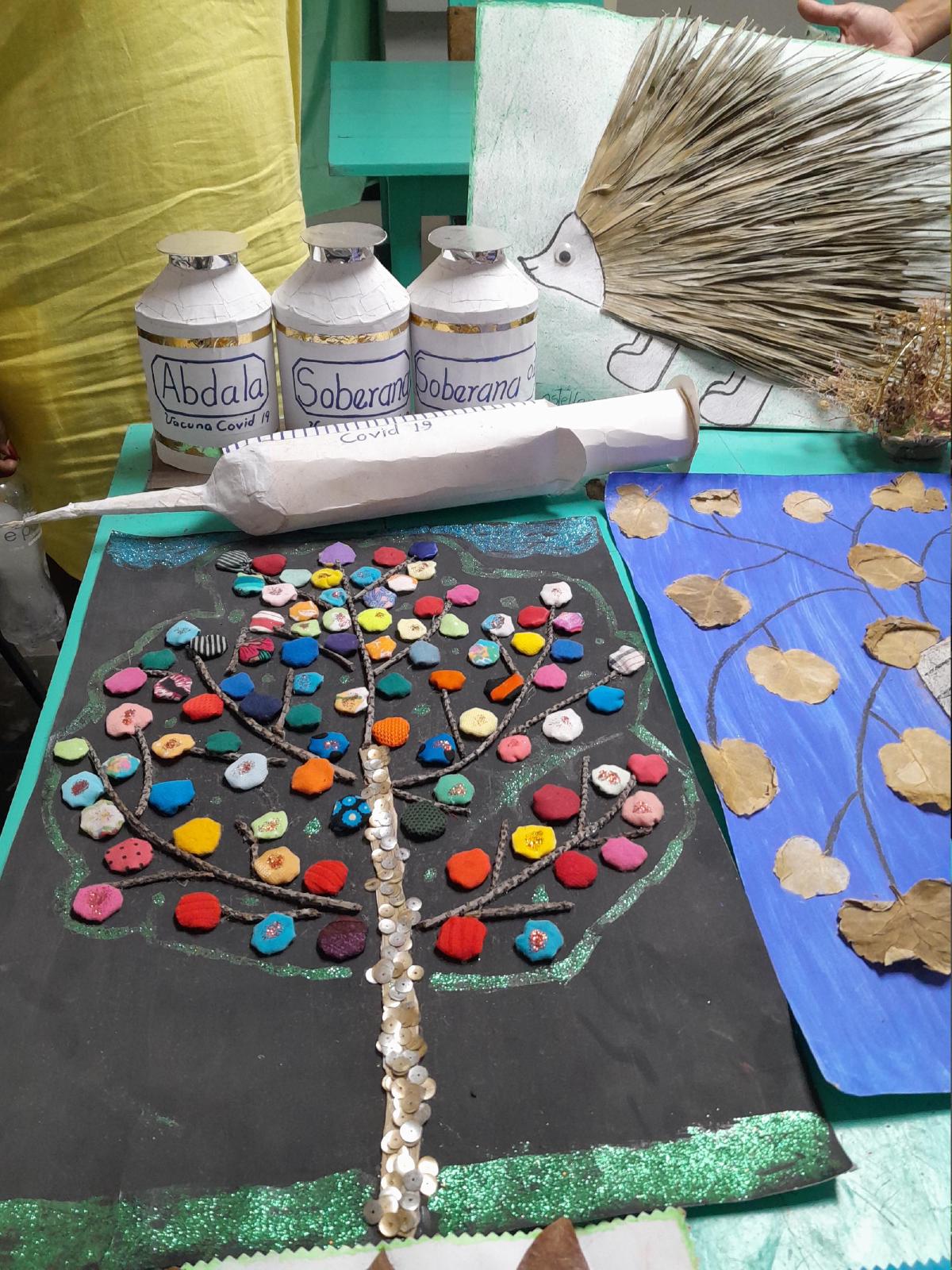 Various arts and crafts, including models of vaccines and a syringe