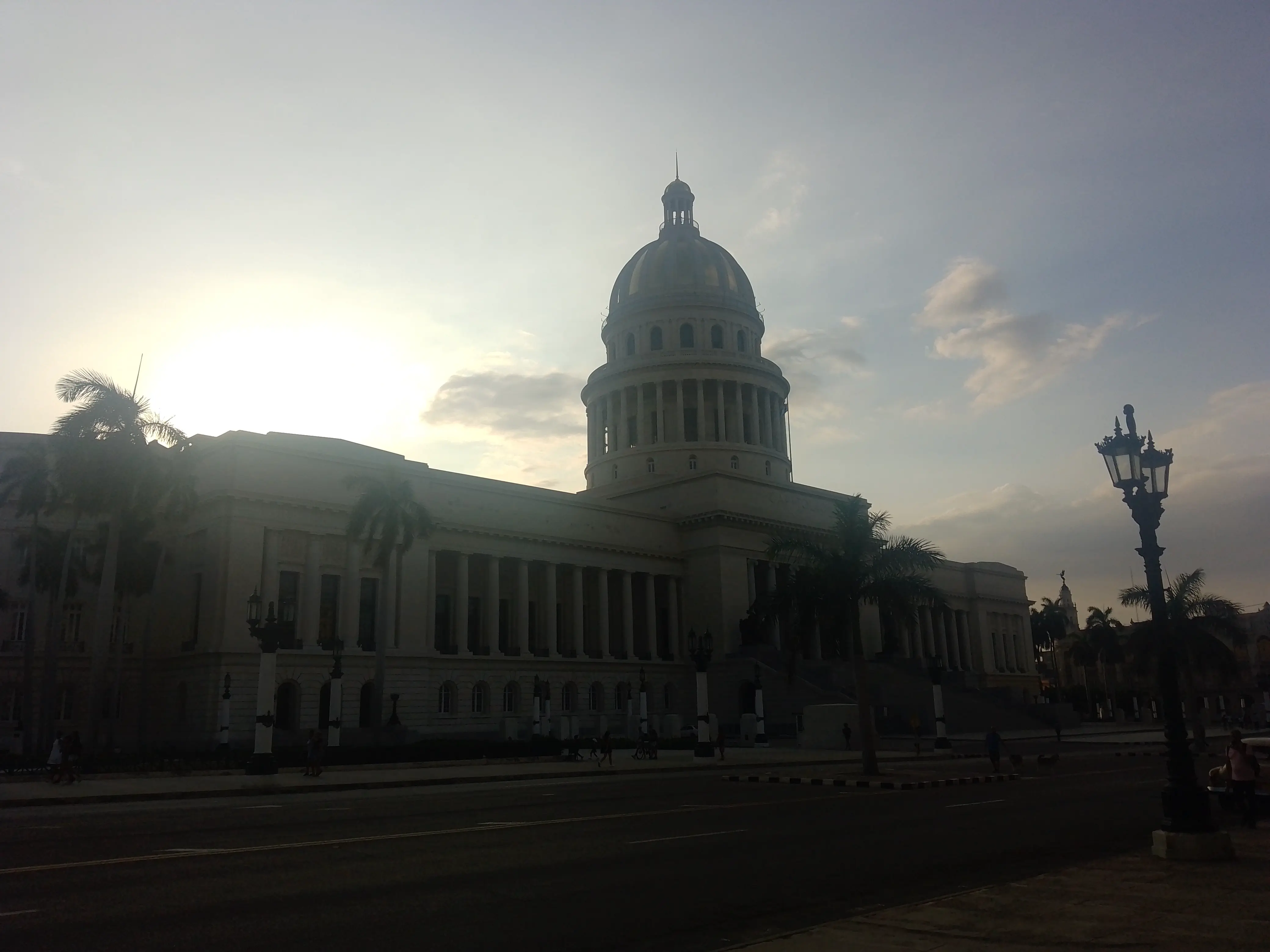 The sun setting behind the dome of the Cuban Capitol Building