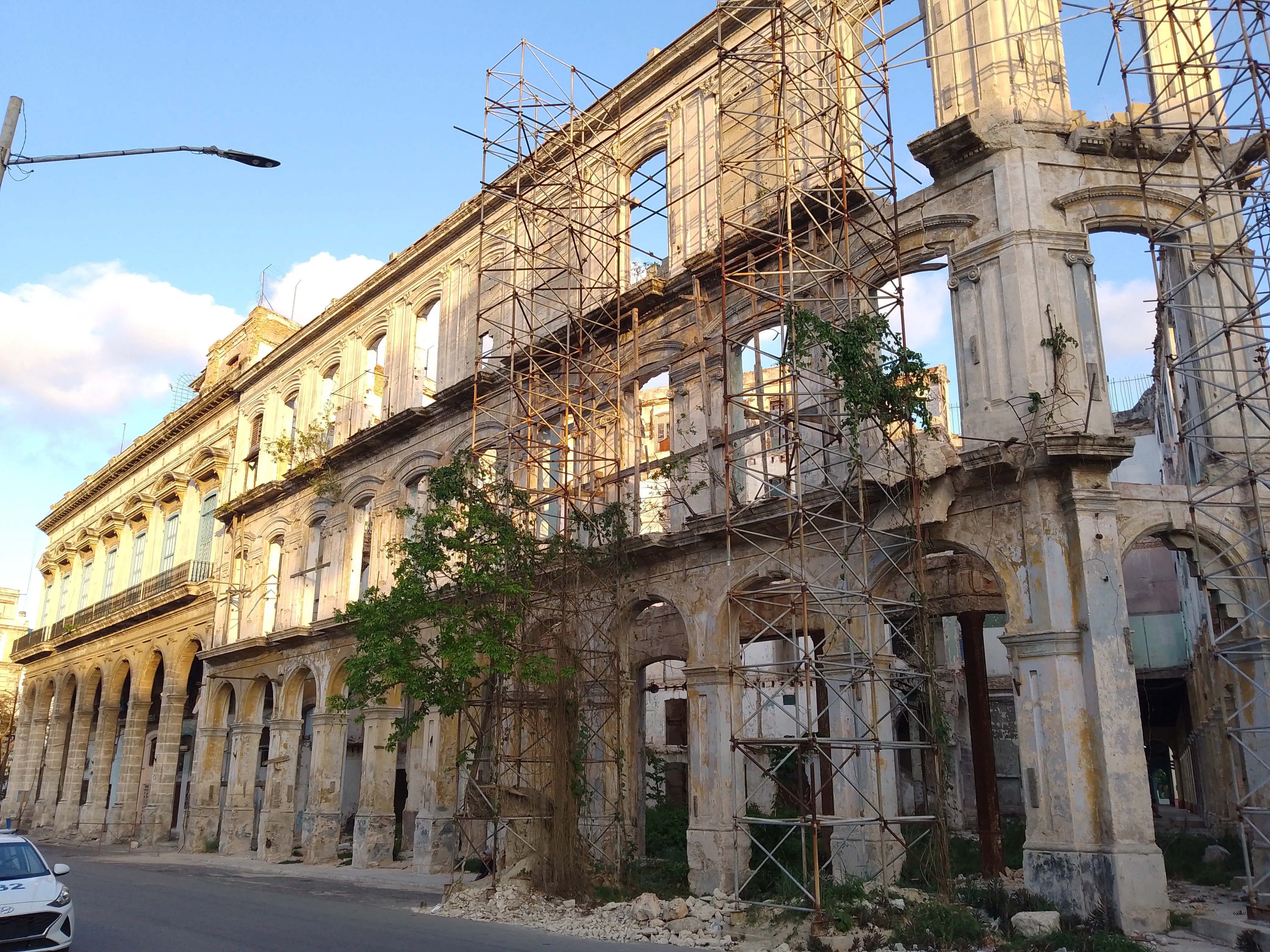 An intricate building façade covered in scaffolding