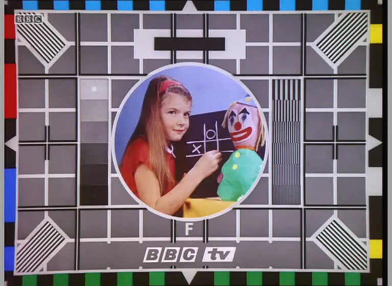 BBC test card F, showing a girl and a clown doll