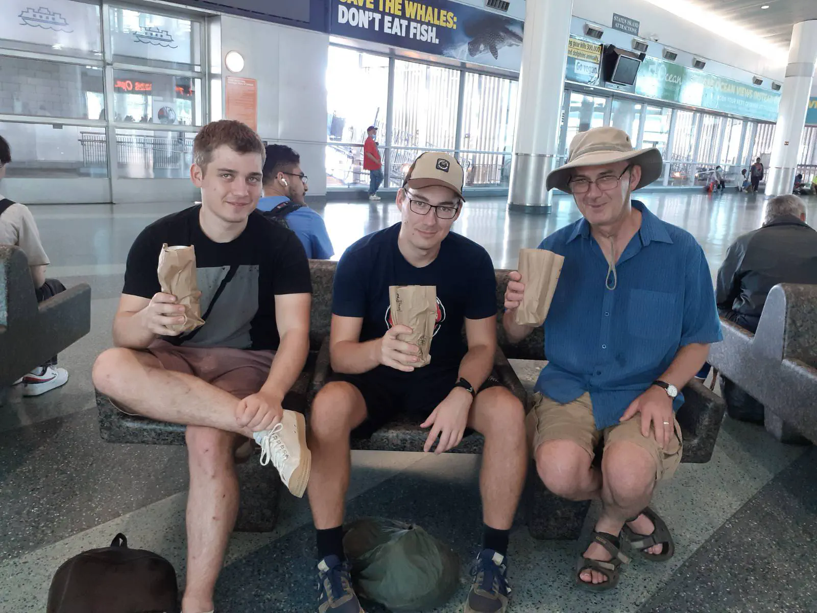 Three men drinking beers