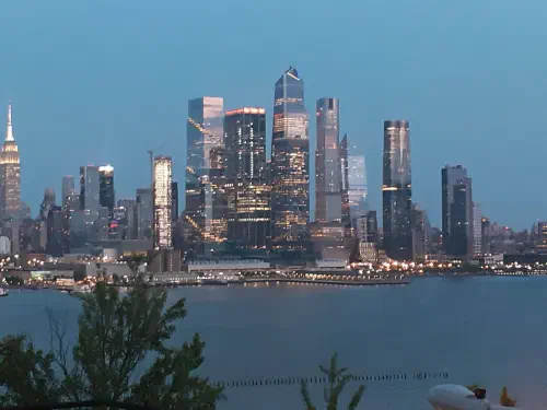 The New York City skyline at night, seen from across the Hudson