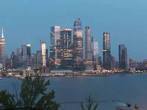 The New York City skyline at night, seen from across the Hudson
