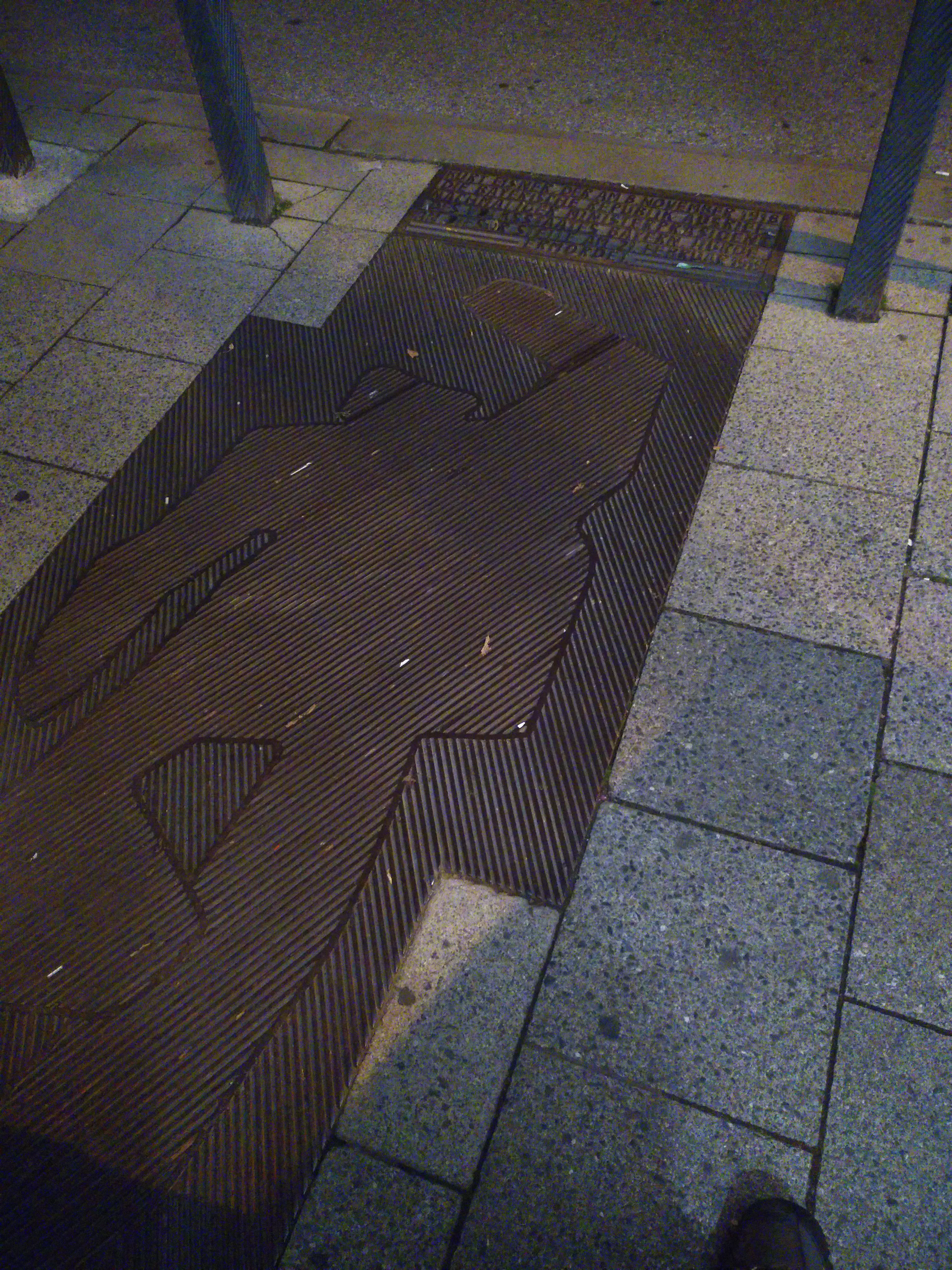 The Kurt Eisner memorial, featuring the outline of a man laying on the pavement
