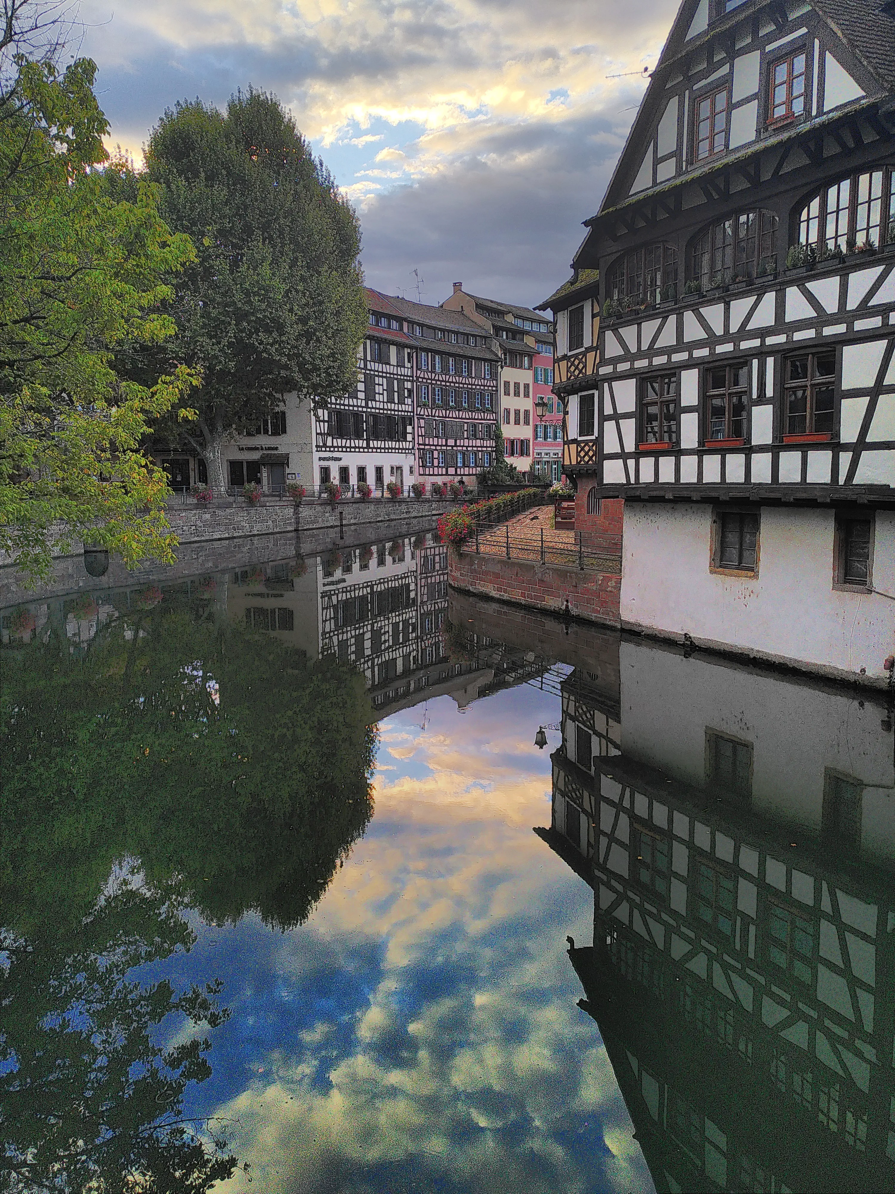 A canal and an old-style wooden house