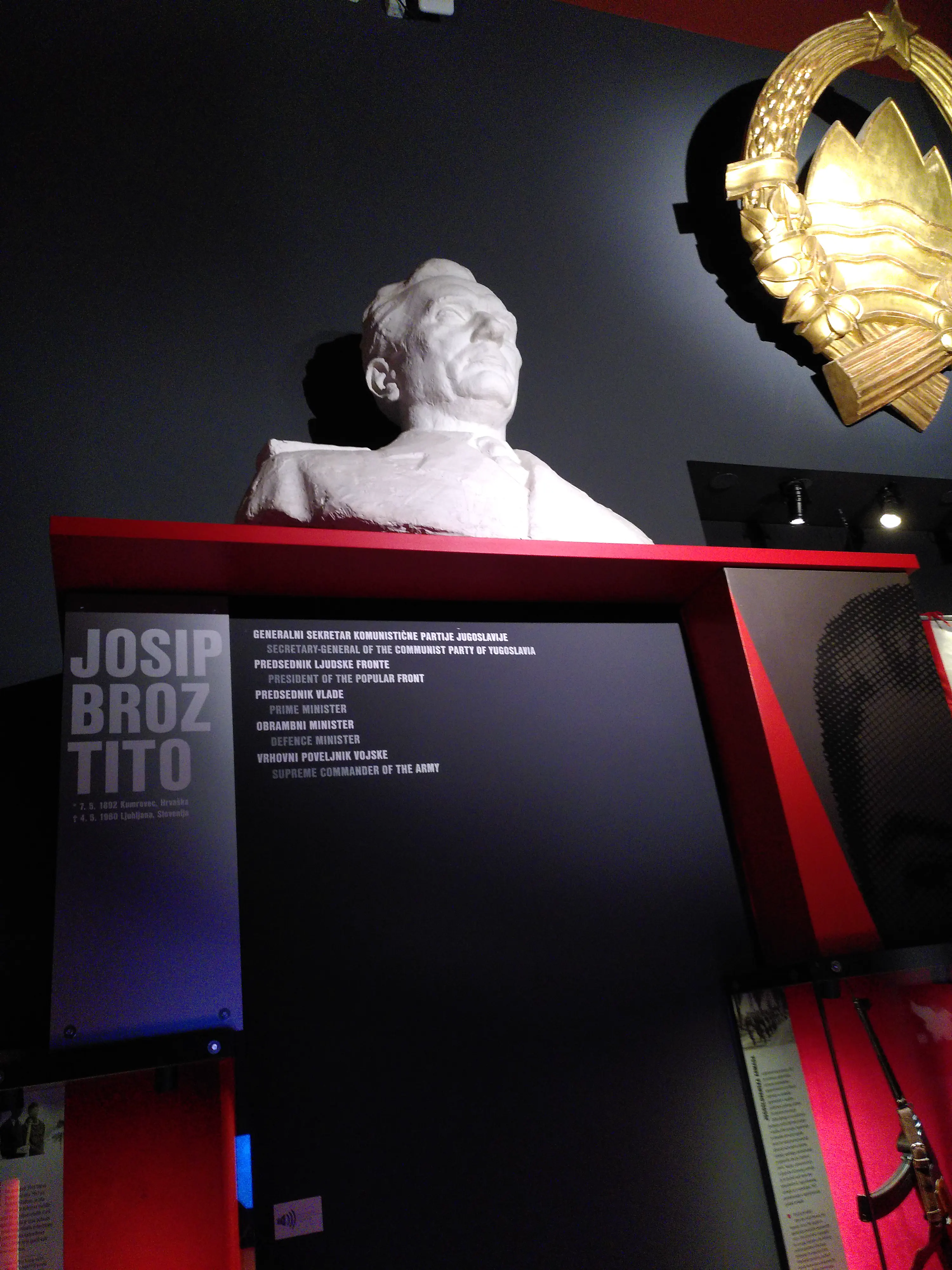 A dramatically-lit bust of Josip Broz Tito