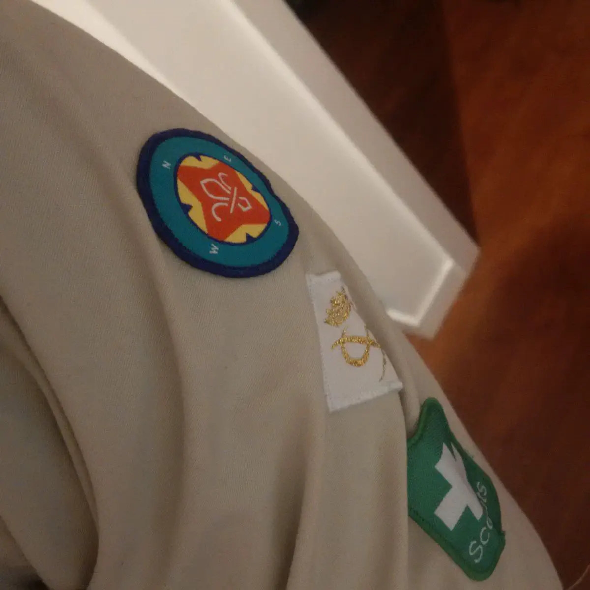 A Scouts shirt with an Explorer Belt sewn onto the upper arm