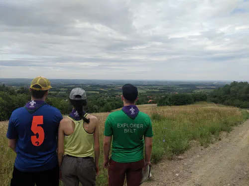Four people seen from by behind, looking out over the Serbian landscape
