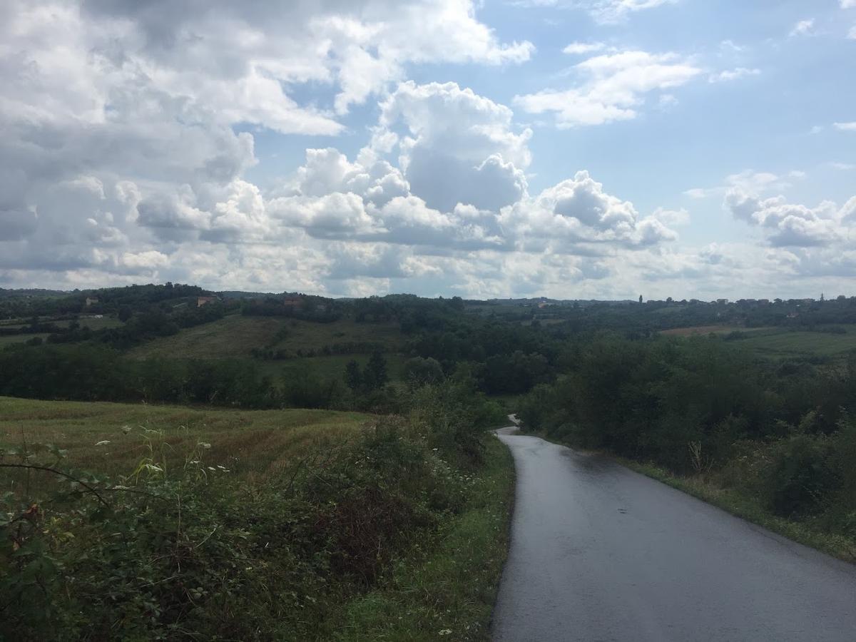 A road stretching off into the distance over several hills