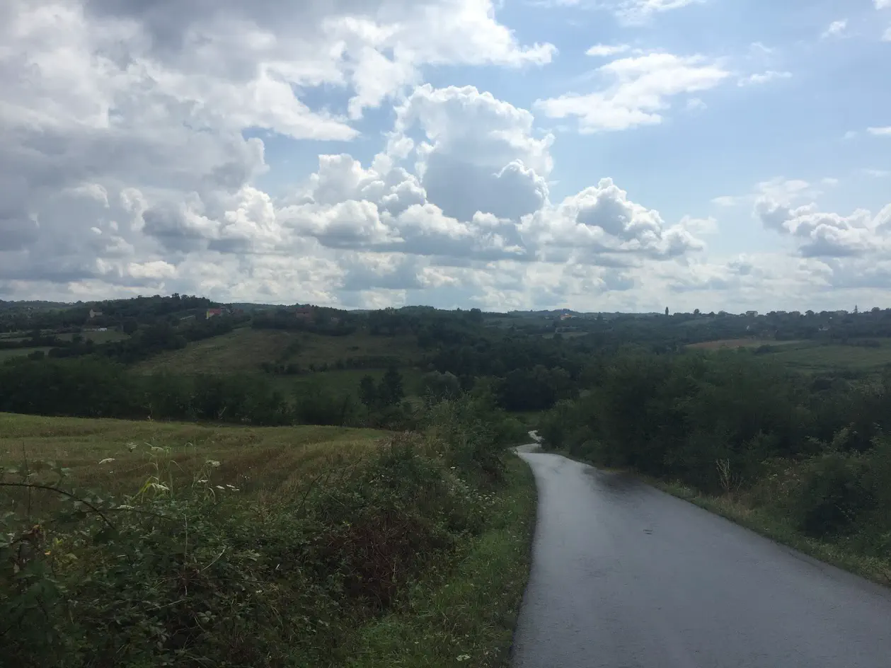 A road stretching off into the distance over several hills