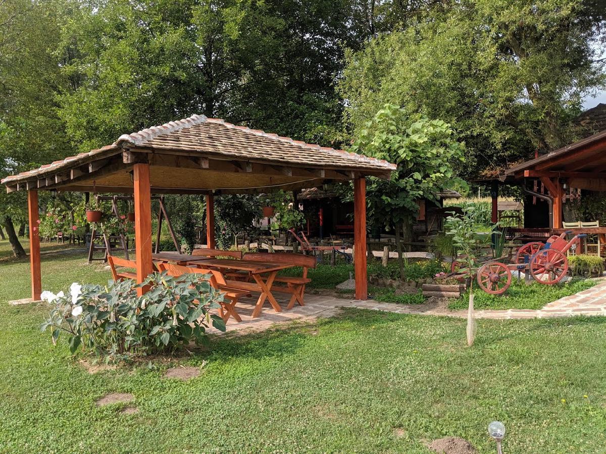 A picnic bench area in a nicely-manicured garden
