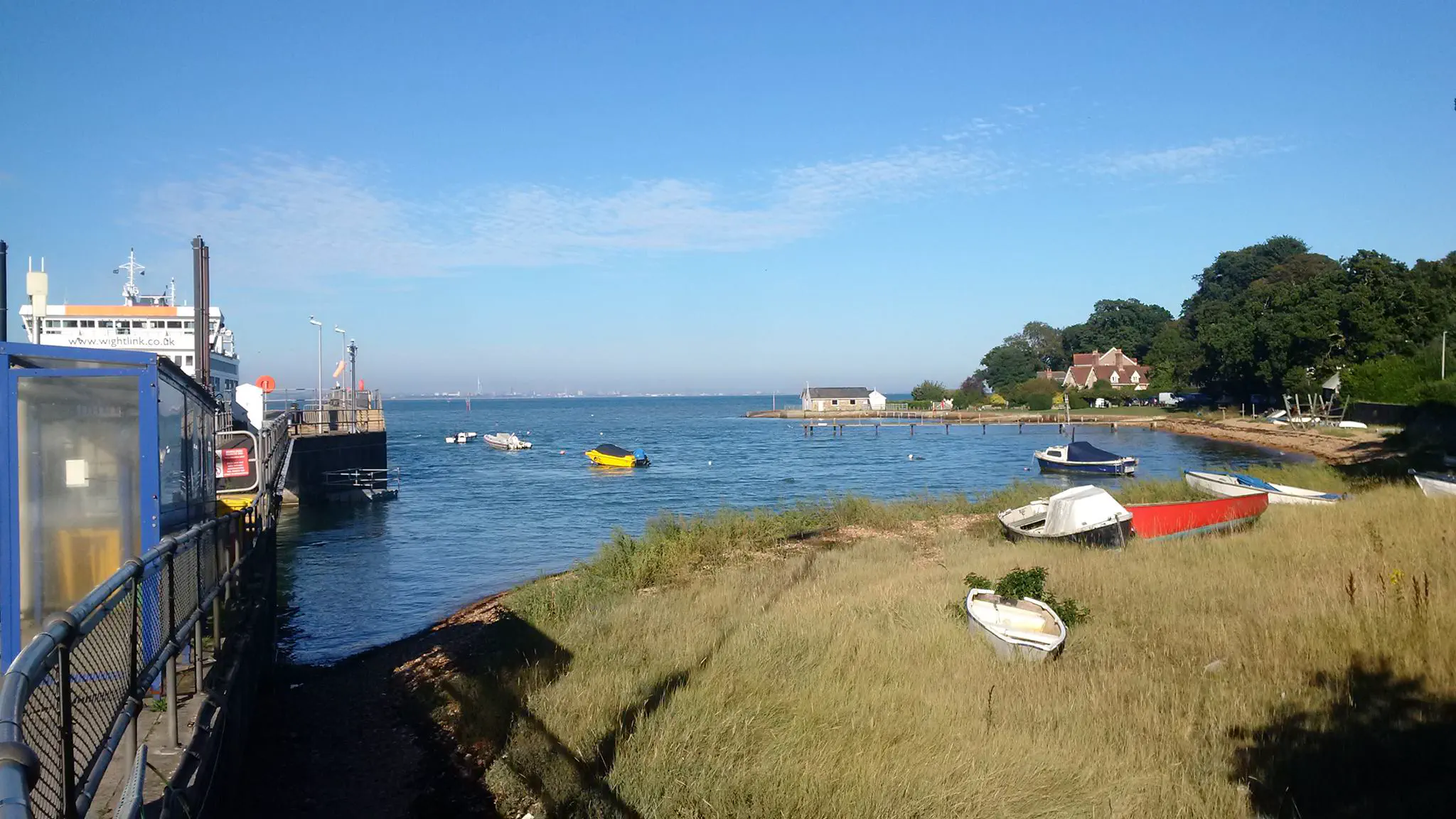 A small pier with several boats
