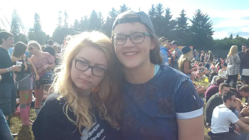 Two girls posing in a festival campsite