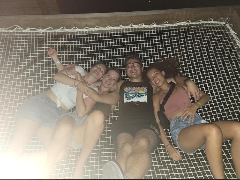The author and several girls laying on netting