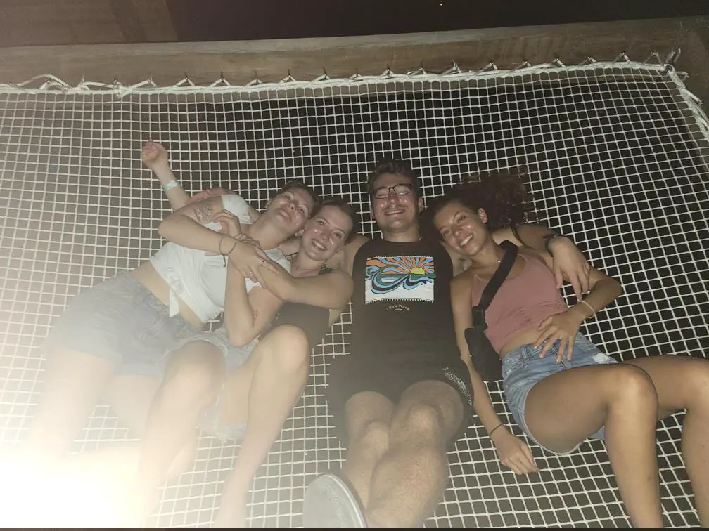 The author and several girls laying on netting