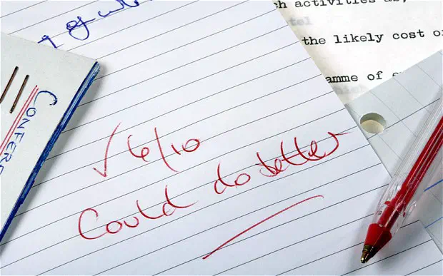 A notebook with '6/10 could do better' written in red ink