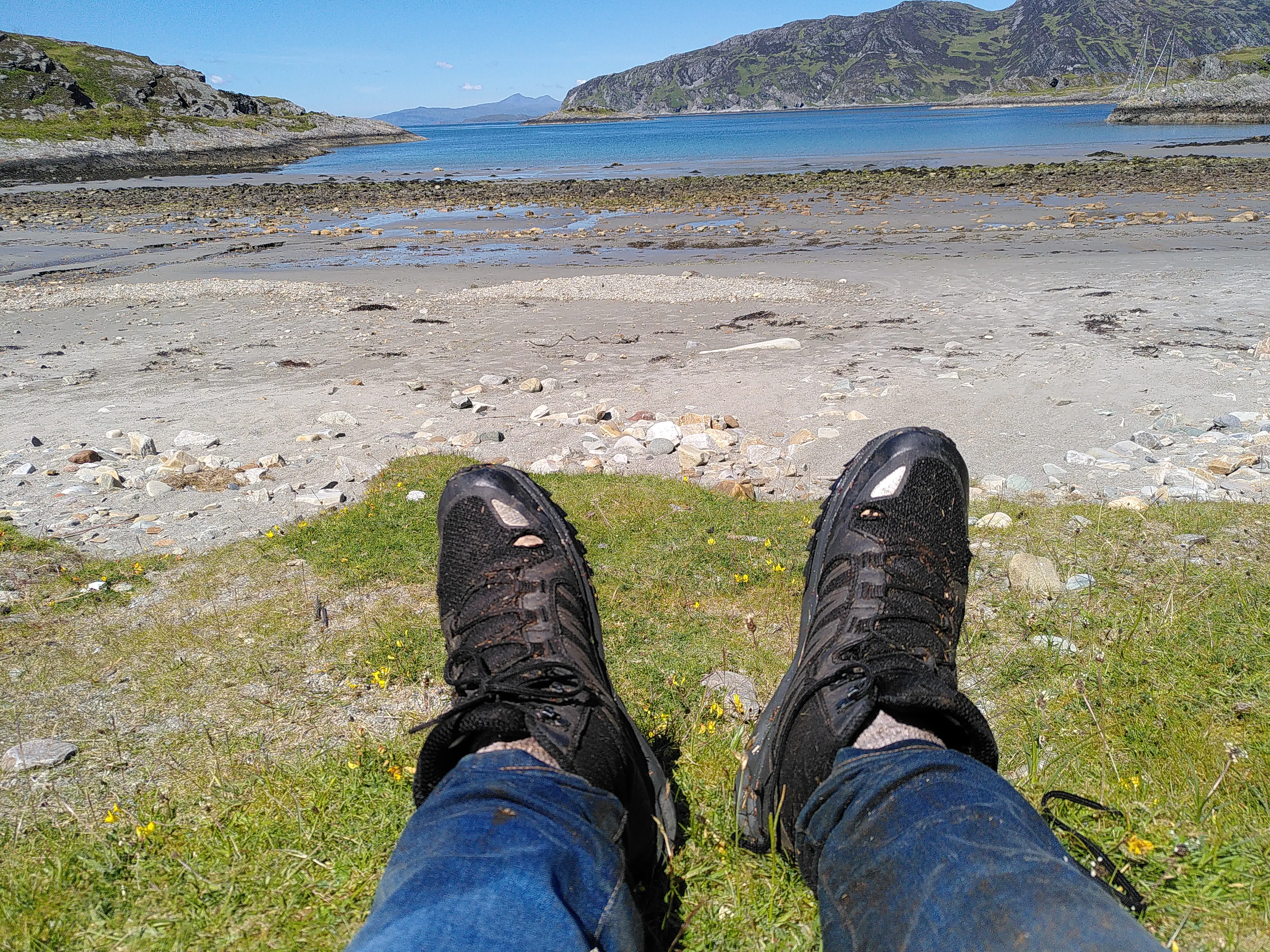A picturesque bay in the background and my muddy boots in the foreground