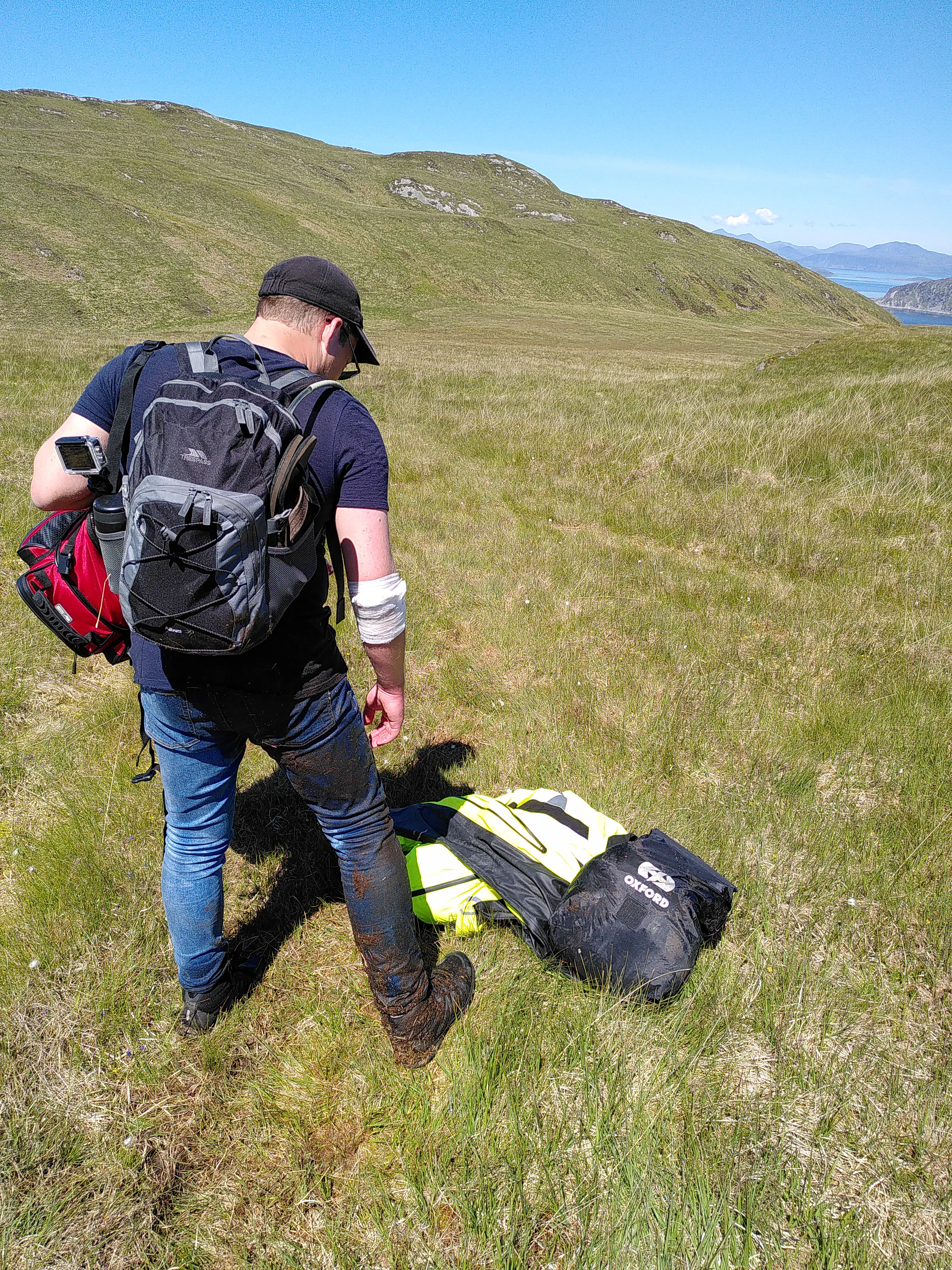 Me from behind, with my right leg covered in bog muck