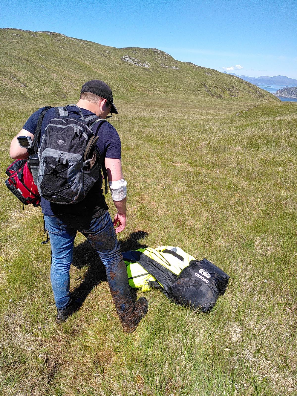 Me from behind, with my right leg covered in bog muck
