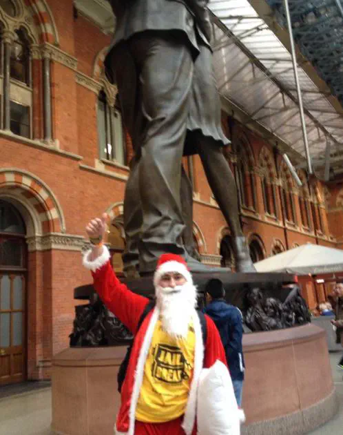 Me pointing up at a statue