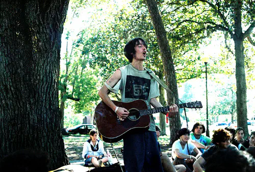 Pat the Bunny playing guitar in a park