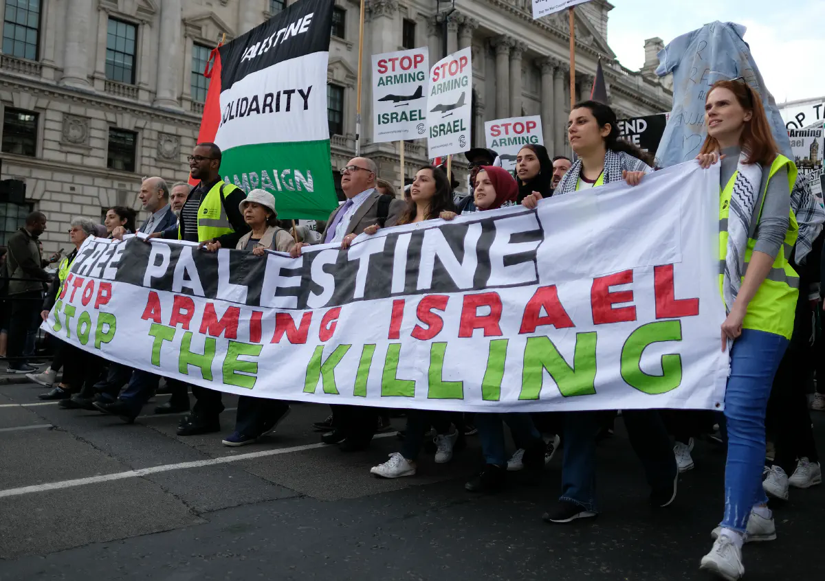 Palestine solidarity protesters march towards the British parliament on 5 June 2018.