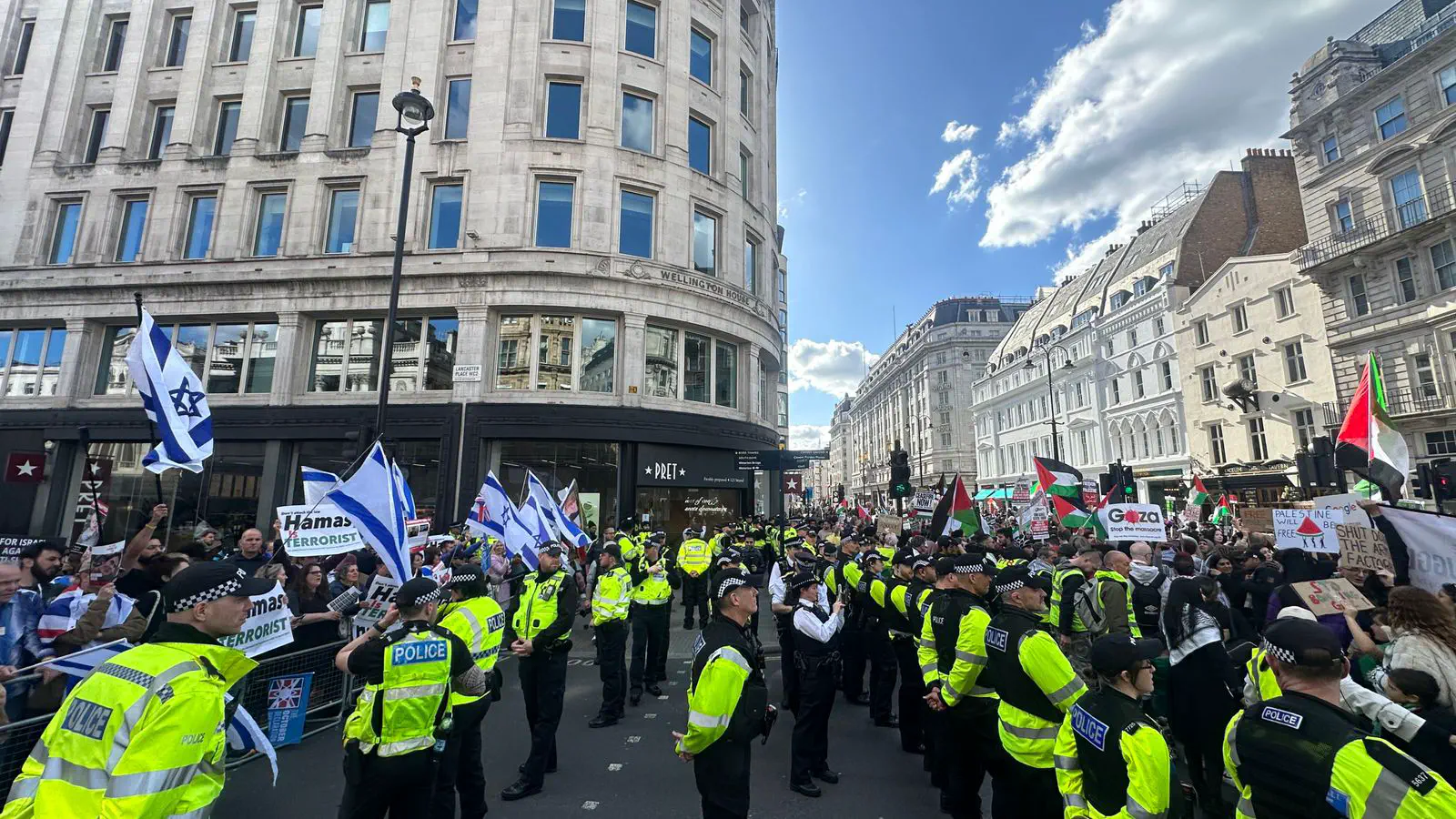 Police officers separating a march and counter-demonstration