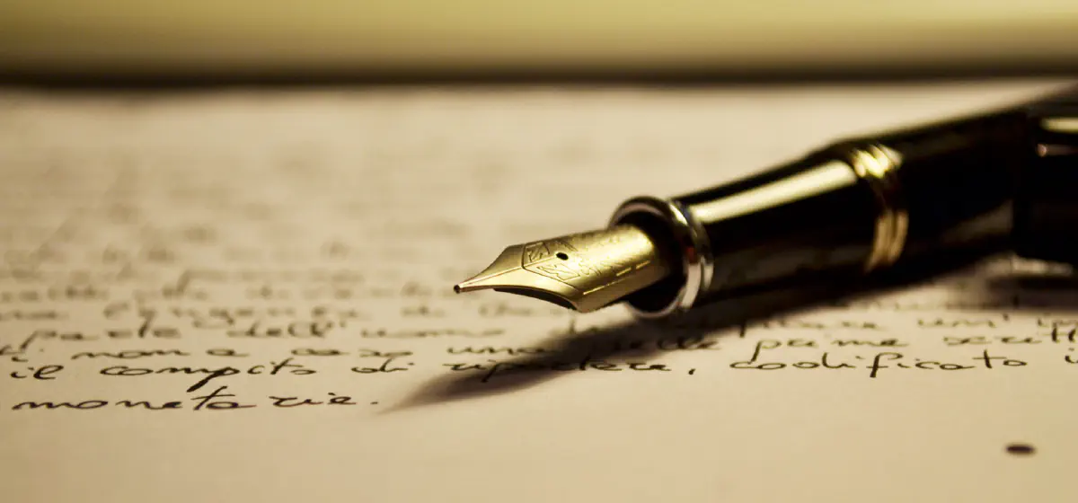 A Stipula fountain pen lying on a written piece of paper.