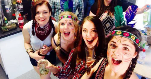 Students partying, dressed as cowboys and Indians