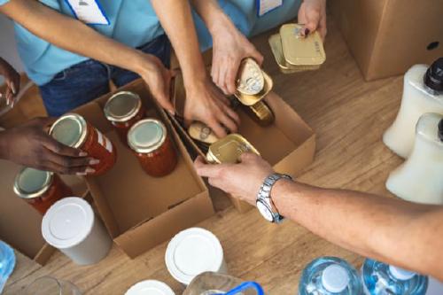 Volunteers peparing food packages