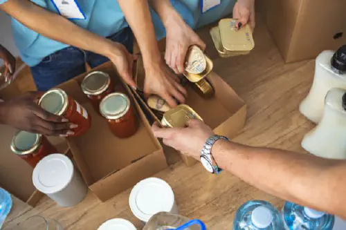 Volunteers peparing food packages