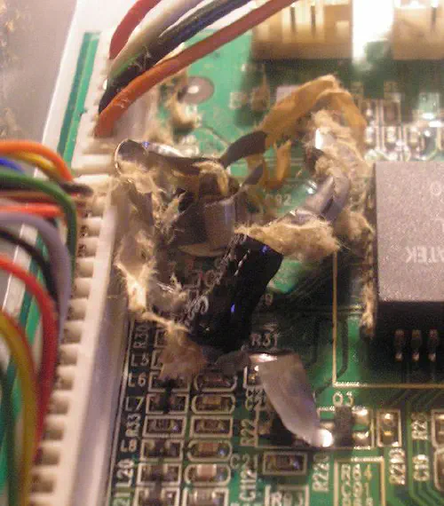 A failed electrolytic from a broken LCD monitor. The power supply failed and overheated the cap causing explosion.