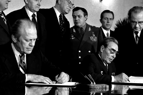 Gerald Ford and Leonid Brezhnev signing a document