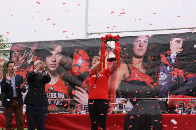 Person lifting a trophy