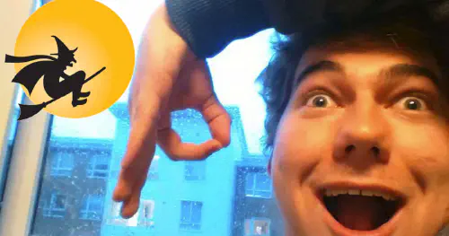 The author smiling and forming a 'P' with his fingers