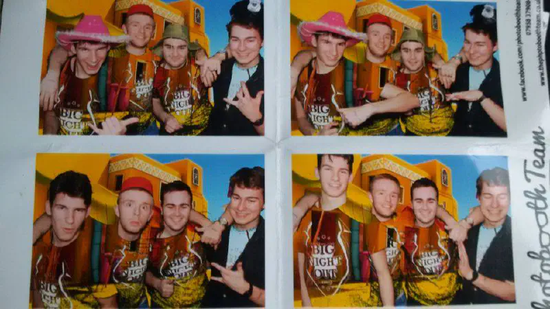 A grid of photobooth photos showing a group of students in fancy dress